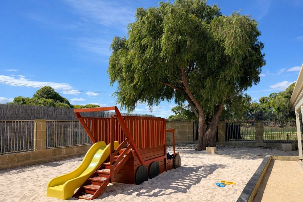 Shaded sandpit and climbing playground at Super Stars Early Learning Centre Cooloongup